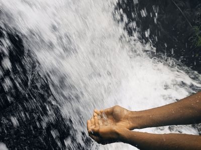 Close-up of a person's hands in a graceful, flowing motion.